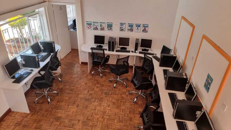 Modern computer lab with laptops and desktop workstations