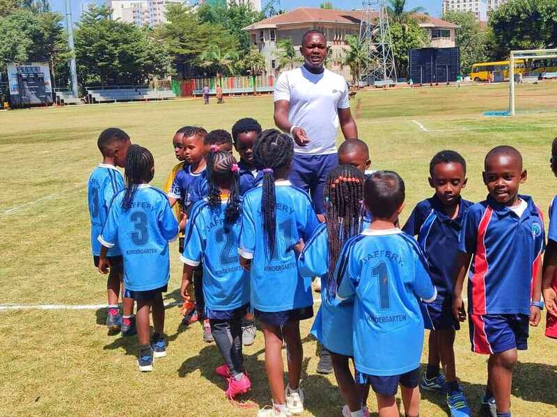 Students during football training with their coach