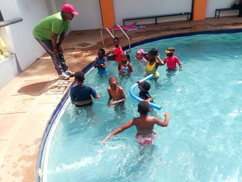 Students enjoying a swimming lesson in the school pool