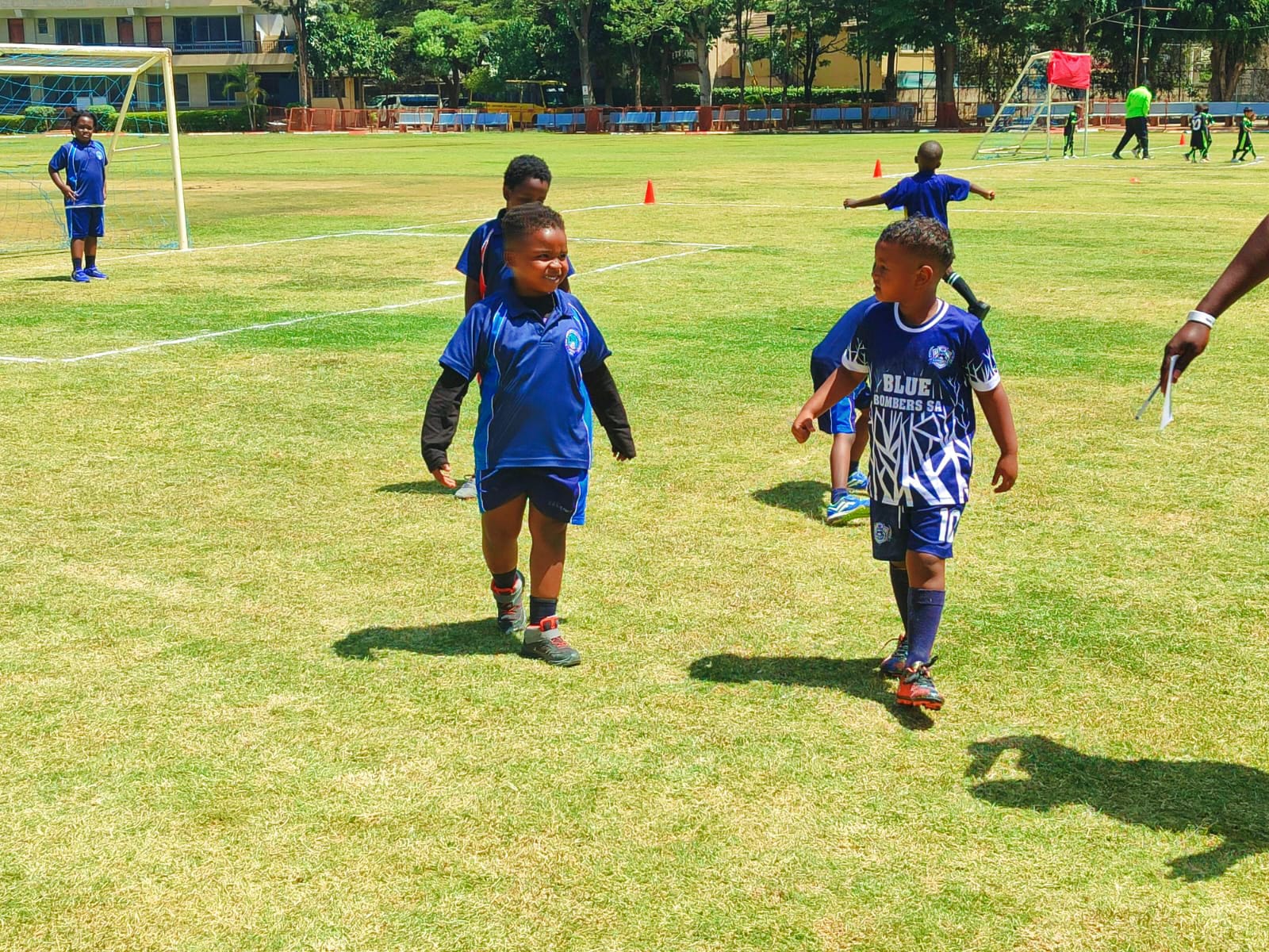Two young players walking off the pitch together